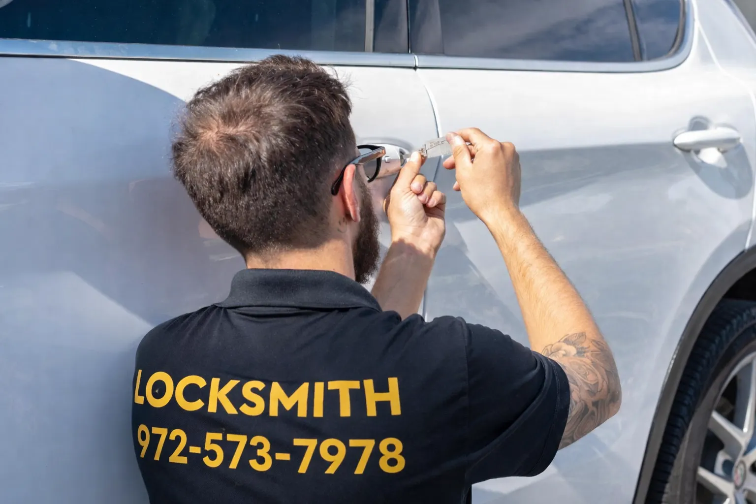 Automotive locksmith at work programming car key on white vehicle in Southlake TX